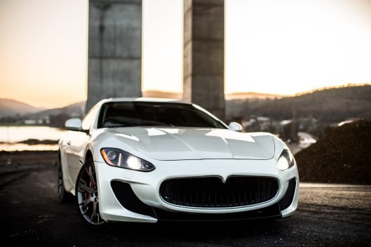 white-coupe-sport-car-standing-road-front-view
